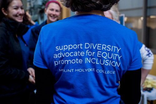 The back of a t-shirt with the saying "Support diversity, advocate for equity, promote inclusion"